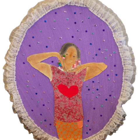 Self-portrait of young girl wearing a red shirt with a large heart on it