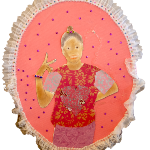 Self-portrait of a young girl posing with peace sign in front of a pink background