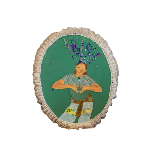 Self-portrait of a young girl with a sparkly bow, making heart shape with her hands