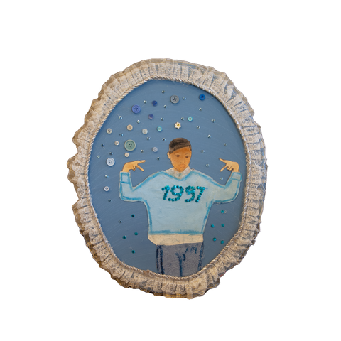 Self-portrait of young girl wearing a blue sweater with 1997 on it