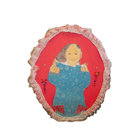 Self-portrait of a young girl wearing floral print and making heart symbols with her hands