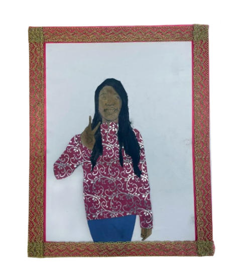 Self portrait of a young girl with long, dark hair and wearing a colorful shirt.